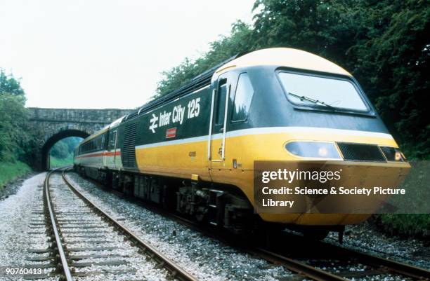 In 1985 livery passing under a bridge.