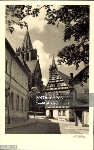 Foto Ak Arnstadt im Ilm Kreis Thüringen, Straßenpartie, Fachwerkhaus, Kirche