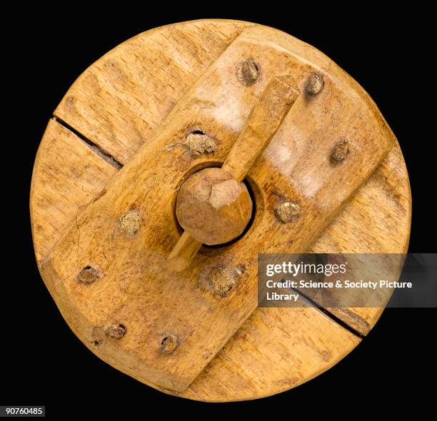 Scale model of a solid wooden chariot wheel. The two-wheeled chariot was invented by the Sumerians in Mesopotamia probably some time between 3500 and...