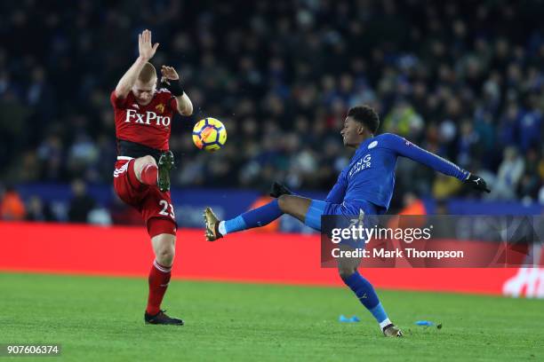 Ben Watson of Watford attempts to block Demarai Gray of Leicester City from getting the ball during the Premier League match between Leicester City...