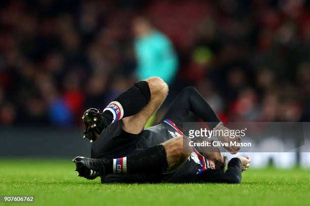 Yohan Cabaye of Crystal Palace goes down in pain during the Premier League match between Arsenal and Crystal Palace at Emirates Stadium on January...