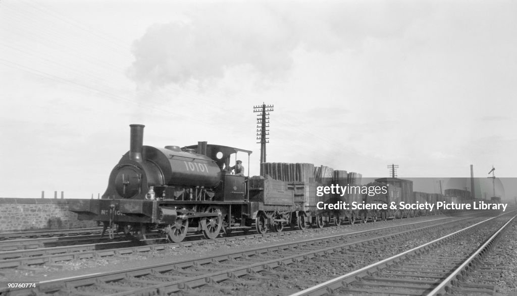 NBR steam locomotive hauling freight, c 1900s.