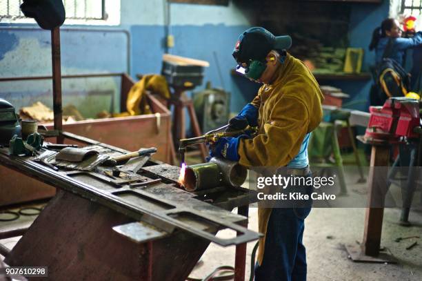 Students learning welding skills at the workshop training school in San Felipe neighborhood in Old Panama.