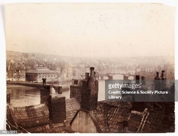 Photograph by Frank Meadow Sutcliffe , looking south over rooftops from the Spion Kop viewpoint at the top of West Cliff in Whitby. It was from this...
