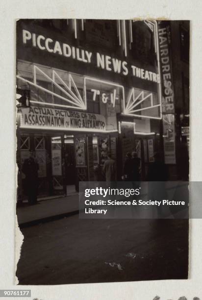 Snapshot photograph of the Piccadilly News Theatre at night, taken by an unknown photographer in 1934. News theatres which showed newsreels played a...