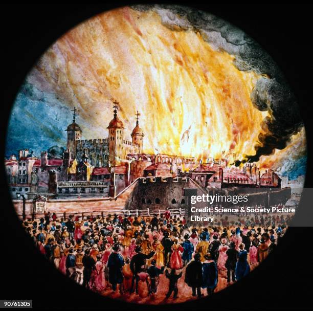 Magic lantern slide showing the Great Fire of London raging, watched by a huge crowd of people. Although the fire reached the gates, the Tower...