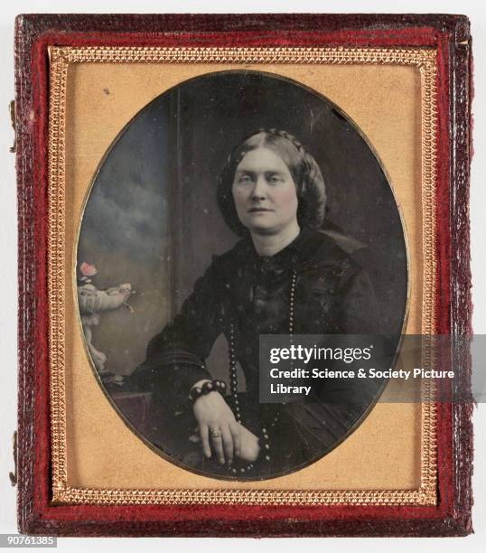 Collodion positive believed to be of a Mrs Adams , taken by an unknown photographer in about 1860. She is wearing a beaded necklace and two large...