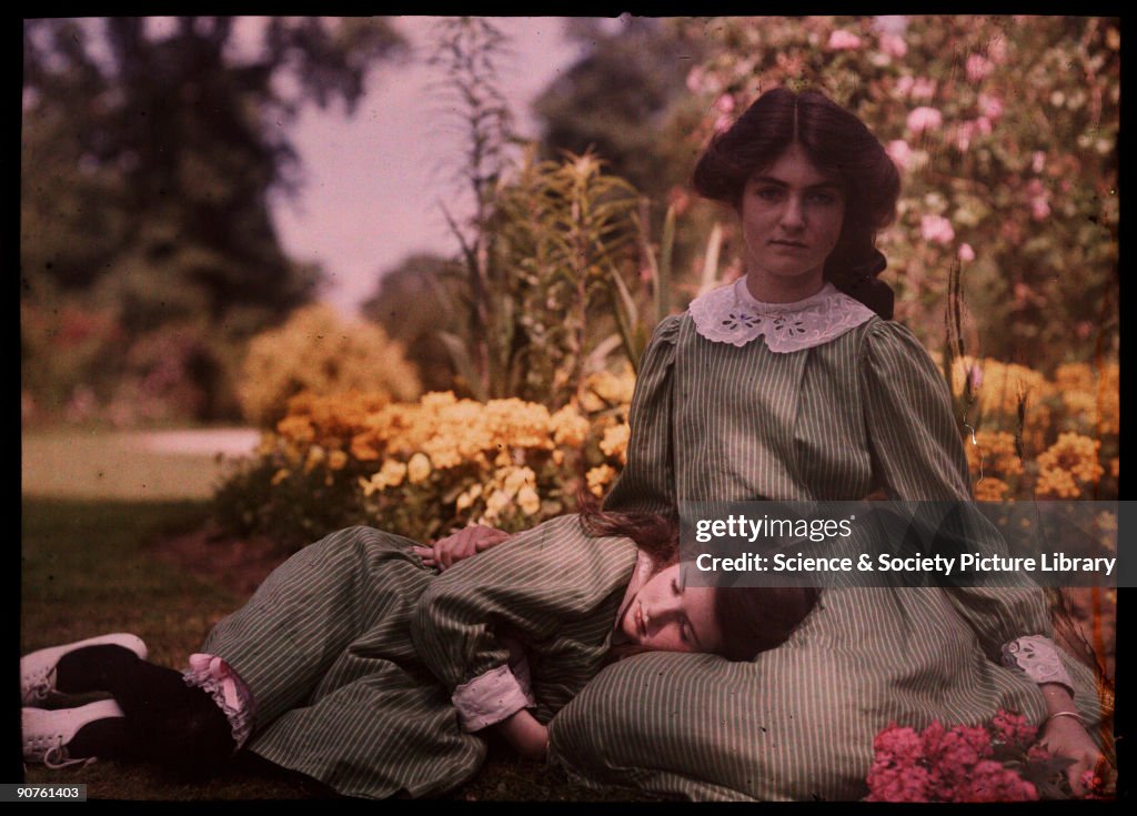 Two girls together in a garden, 1908.