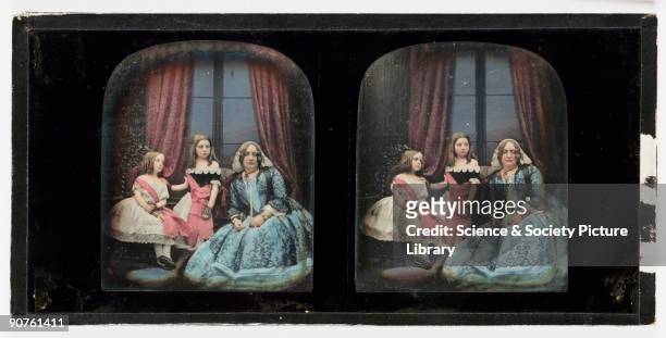 Hand-coloured stereoscopic daguerreotype of a woman with two young girls, taken at the studio of Antoine Claudet . Born in Lyons, France, Claudet...