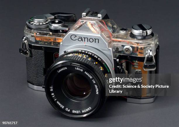 Automatic single lens reflex 35mm camera made by Canon, partically cut away to show internal construction.
