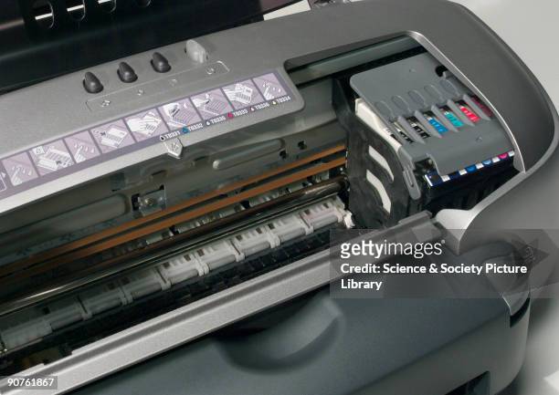 Epson Stylus Photo 950 colour inkjet printer, launched in 2002, with roll feeder, automatic paper cutter, and full bleed printing.
