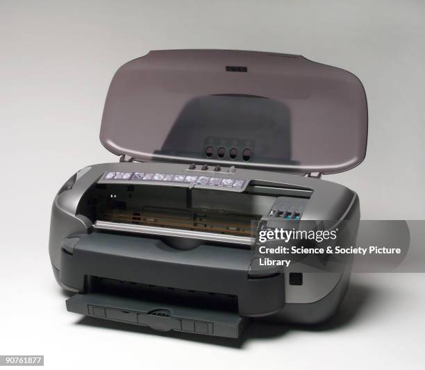 Epson Stylus Photo 950 colour inkjet printer, launched in 2002, with roll feeder, automatic paper cutter, and full bleed printing.