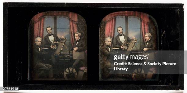 Hand-coloured stereoscopic daguerreotype of Antoine Claudet and his sons posed with daguerreotype apparatus, taken at the studio of Antoine Claudet ,...