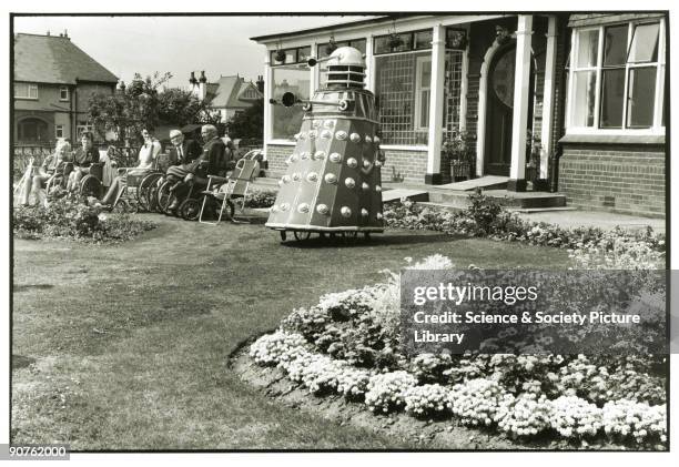 Dalek outside old people's home in Clacton, c 1960s. Tony Ray-Jones created most of his images of the British at work and leisure between 1966-1969....