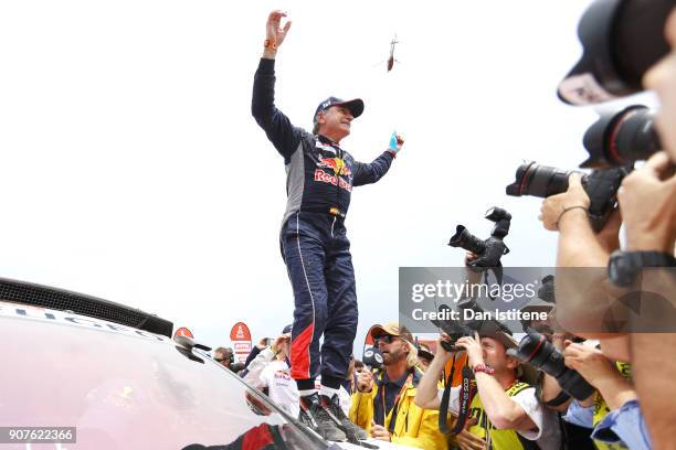 Carlos Sainz of Spain and Peugeot Total celebrates victory at the end of stage fourteen of the 2018 Dakar Rally, a loop stage to and from Cordoba on...