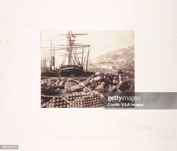 Photograph by Roger Fenton , one of the first war photographers, of piles of cannon-balls on the quayside at Balaklava during the Crimean War. Huge...