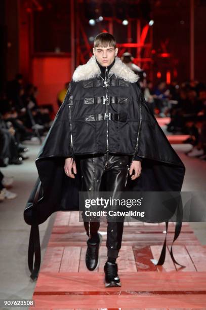 Model walks the runway at the Alexander McQueen Autumn Winter 2018 fashion show during Paris Menswear Fashion Week on January 19, 2018 in Paris,...