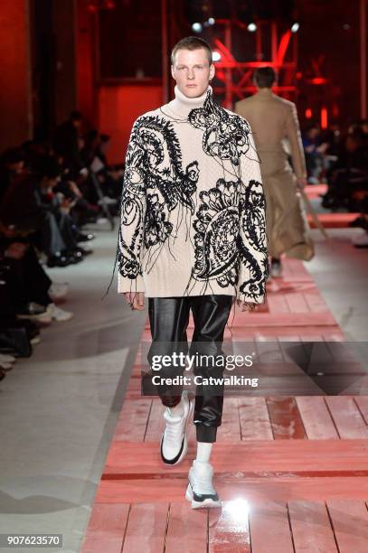 Model walks the runway at the Alexander McQueen Autumn Winter 2018 fashion show during Paris Menswear Fashion Week on January 19, 2018 in Paris,...