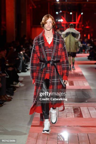 Model walks the runway at the Alexander McQueen Autumn Winter 2018 fashion show during Paris Menswear Fashion Week on January 19, 2018 in Paris,...