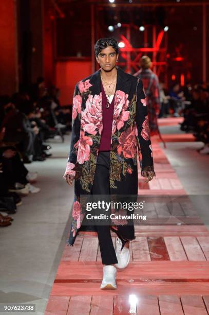 Model walks the runway at the Alexander McQueen Autumn Winter 2018 fashion show during Paris Menswear Fashion Week on January 19, 2018 in Paris,...