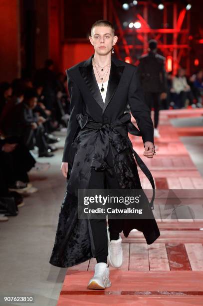 Model walks the runway at the Alexander McQueen Autumn Winter 2018 fashion show during Paris Menswear Fashion Week on January 19, 2018 in Paris,...