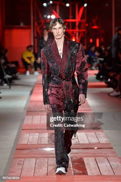 Model walks the runway at the Alexander McQueen Autumn Winter 2018 fashion show during Paris Menswear Fashion Week on January 19, 2018 in Paris,...