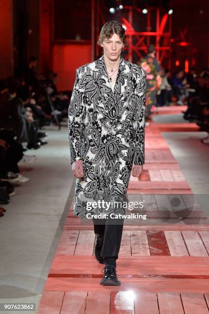 Model walks the runway at the Alexander McQueen Autumn Winter 2018 fashion show during Paris Menswear Fashion Week on January 19, 2018 in Paris,...