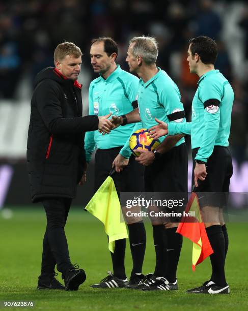 Eddie Howe, Manager of AFC Bournemouth shakes hands with Match Referee, Martin Atkinson following the Premier League match between West Ham United...