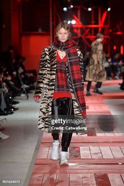 Model walks the runway at the Alexander McQueen Autumn Winter 2018 fashion show during Paris Menswear Fashion Week on January 19, 2018 in Paris,...