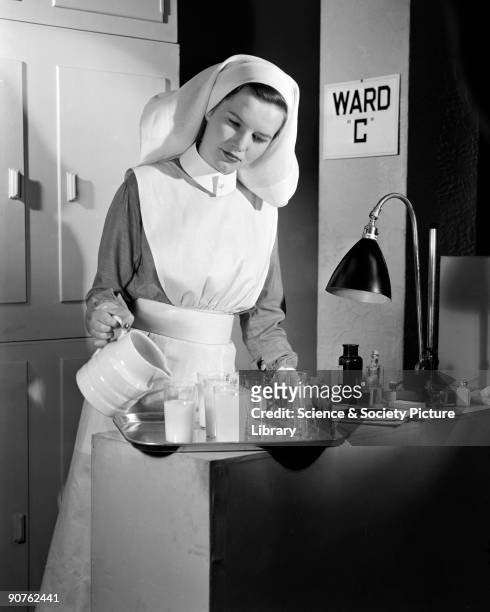 Nurse on 'Ward C' pouring drinks. Photographic Advertising's work includes images of individuals and groups in specific professions, such as nurses...