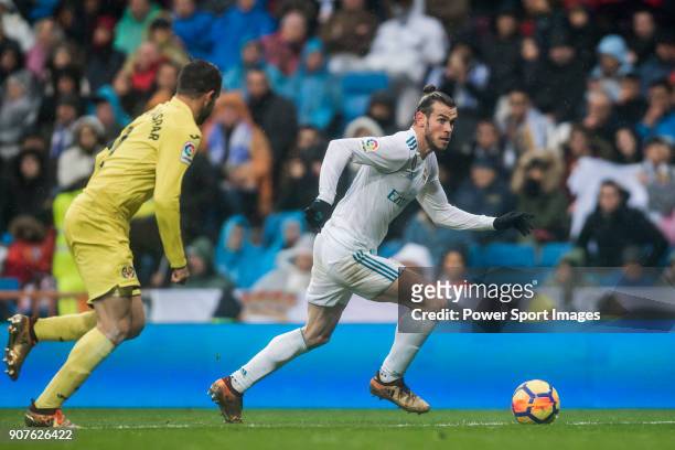 Gareth Bale of Real Madrid is followed by Mario Gaspar Perez Martínez of Villarreal CF during the La Liga 2017-18 match between Real Madrid and...