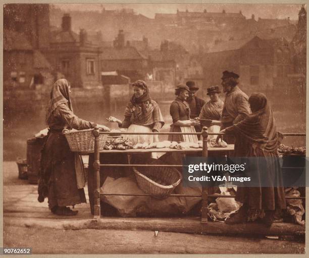 Photograph by Frank Meadow Sutcliffe of women selling fish in the port of Whitby.