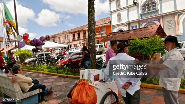 Main square with the Church Parroquia Inmaculada Concepcion on the background. The town of Filandia, currently known as 'La Colina Iluminada de los...