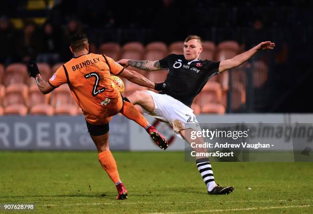 Lincoln City's Harry Anderson vies for possession with Barnet's Richard Brindley during the Sky Bet League Two match between Barnet and Lincoln City...