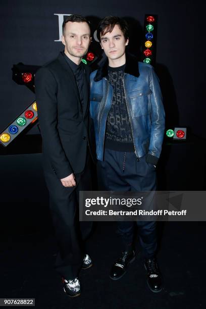 Stylist of Dior Men, Kris Van Assche and Alain-Fabien Delon pose after the Dior Homme Menswear Fall/Winter 2018-2019 show as part of Paris Fashion...