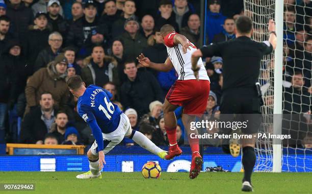 Everton's James McCarthy gets injured after attempting to block a shot from West Bromwich Albion's Salomon Rondon during the Premier League match at...