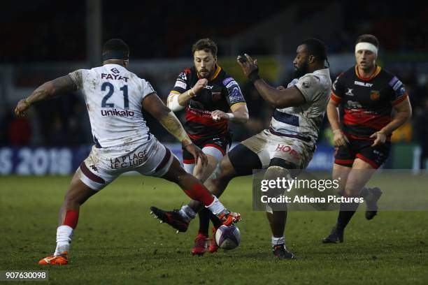 Dorian Jones of Dragons is challenged by Peni Ravai and Apisai Naqalevu of Bordeaux Beglesthe European Challenge Cup match between Dragons and...