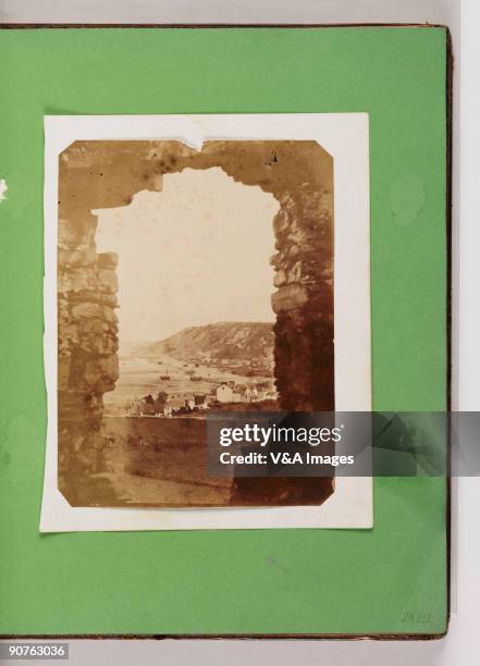 View of the village of Mumbles from a window at Oystermouth Castle in South Wales. The castle dates from the 12th century. From the albums of...