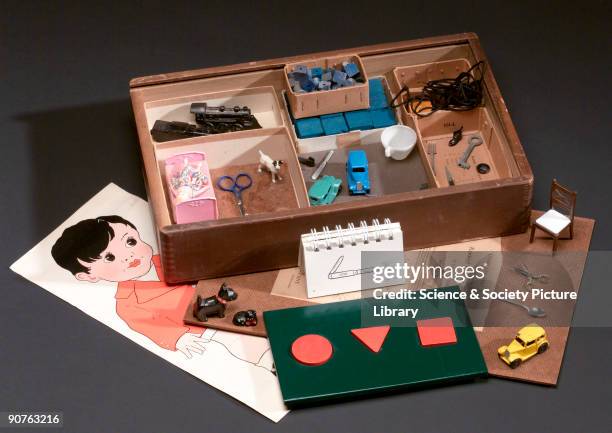 Complete Test Material Form M Revised Stanford-Binet Scales by Terman-Merrill', in wooden case containing form board, printed card material and...