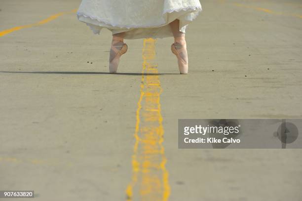 Ballerina dressed up with her wedding dress, in possition with her ballet shoes.MR. Model relased photo.