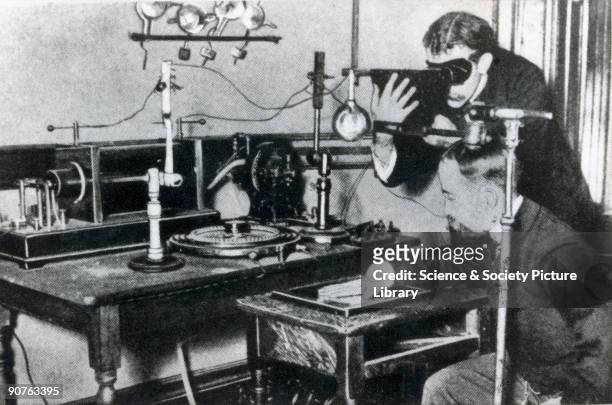 Photograph of an early method of testing the output of X-rays by observing the appearance of a hand through a fluoroscope.
