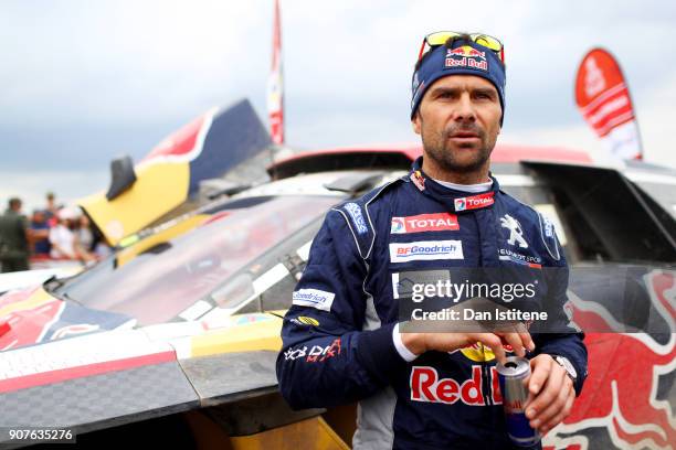 Cyril Despres of France and Peugeot Total speaks with members of the media at the end of stage fourteen of the 2018 Dakar Rally, a loop stage to and...