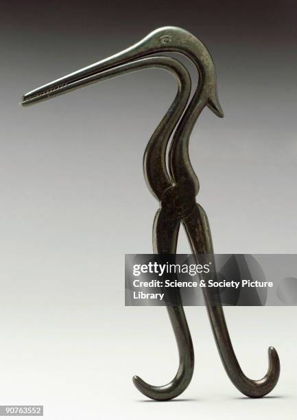 Forceps in the shape of a heron.