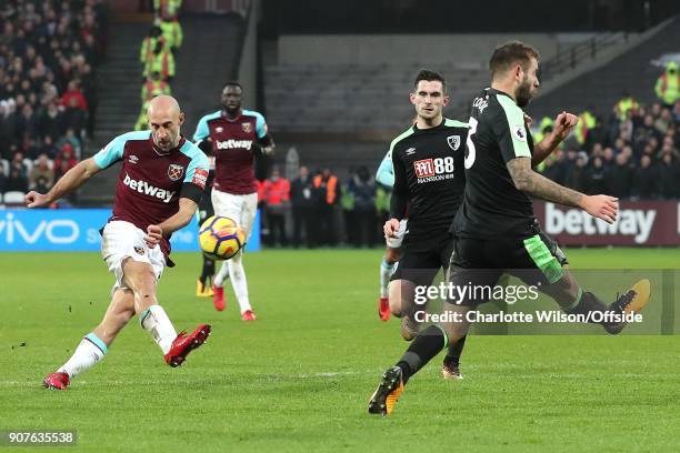 Pablo Zabaleta of West Ham shoots past Steve Cook of Bournemouth during the Premier League match between West Ham United and AFC Bournemouth at...