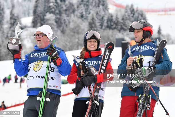 Singer Gerhard Friedle better known as DJ Oetzi , Helene Berger and Roland Berger pose for a picture during the victory ceremony of the...