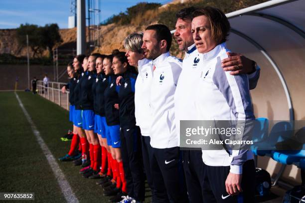 Head Coach Sandrine Soubeyrand of France and staff members look on during the national anthems ceremony before the U17 girl's international friendly...