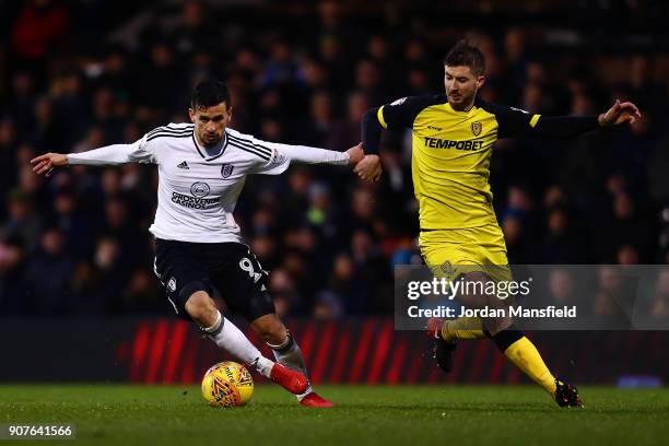 Rui Fonte of Fulham holds off a challenge from Luke Murphy of Burton during the Sky Bet Championship match between Fulham and Burton Albion at Craven...