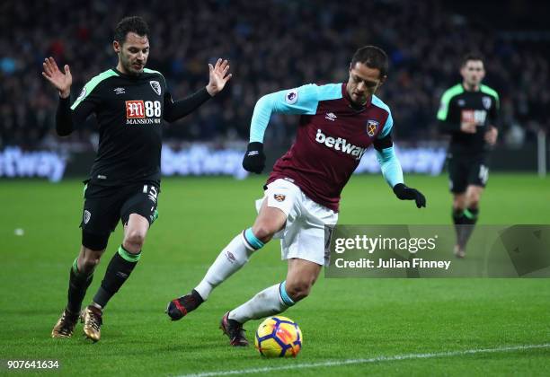 Javier Hernandez of West Ham United battles with Adam Smith of Bournemouth during the Premier League match between West Ham United and AFC...