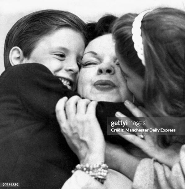 Garland with two of her children, shortly after she settled in England. Garland started performing as a young child. In 1939, aged 17, she starred in...