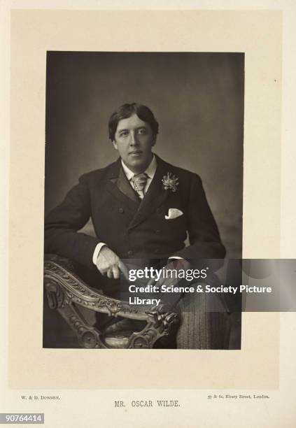 Photographic portrait of Oscar Wilde , taken by W. And D. Downey in 1891. Wilde is pictured seated. An acclaimed Irish playwright, Wilde studied at...